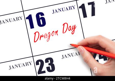 January 16. Hand writing text Dragon Day on calendar date. Save the date. Holiday.  Day of the year concept. Stock Photo