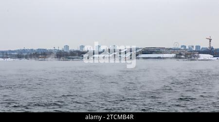 view over the baltic sea to the Tallinn city hall - in estonian Tallinna Linnahall - building in winter Stock Photo