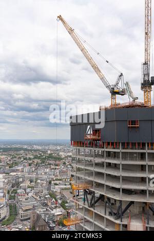 Frankfurt am Main, Germany, August 08, 2023. A skyscraper under construction in Frankfurt Business capital. Concept of modern urban architecture. Stock Photo