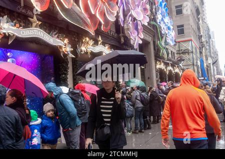 Thousands of tourists and New Yorkers view the Saks Fifth Avenue Christmas display during the Holiday Open Streets on Sunday, December 3, 2023. New York City closed a nine-block stretch of Fifth Avenue in Midtown to vehicles for four Sundays in December creating a holiday block party for visitors. (© Richard B. Levine) Stock Photo