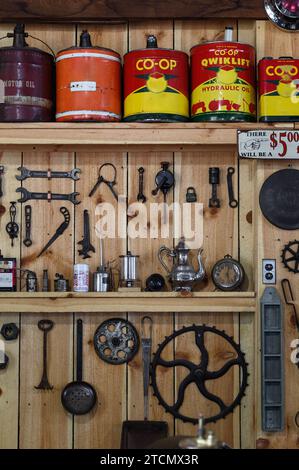 Oil Cans and Tool Display on Wooden Wall - vintage Stock Photo