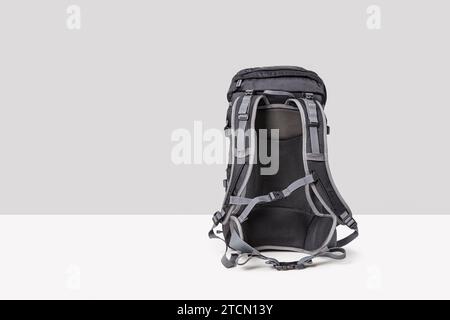 Black travel backpack isolated on a white background, back view Stock Photo