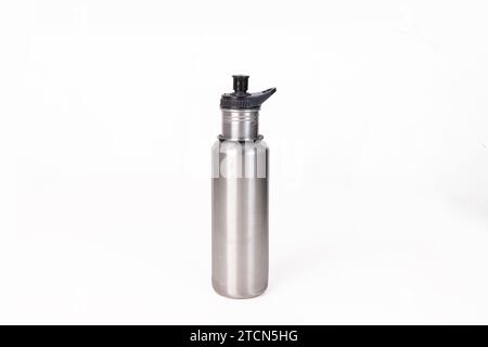 Empty stainless metal water bottle close-up isolated on white background. Studio photography Stock Photo
