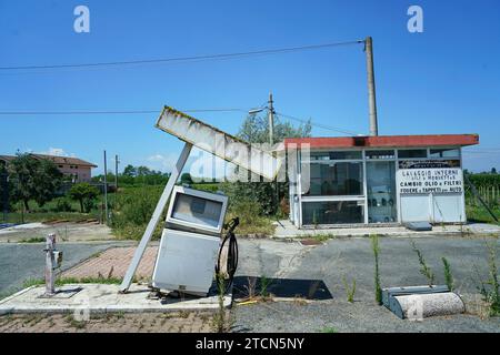 Casale / Italy - July 22, 2023: An abandoned petrol station as a symbol of the energy transition away from fossil fuels Stock Photo