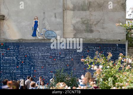 People at The Wall of I Love In the Square Jehan Rictus in Montmartre, Paris, France Stock Photo
