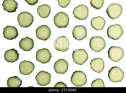 fresh sliced cucumber isolated on white background with clipping path, pattern with organic vegetables, top view, flat lay Stock Photo