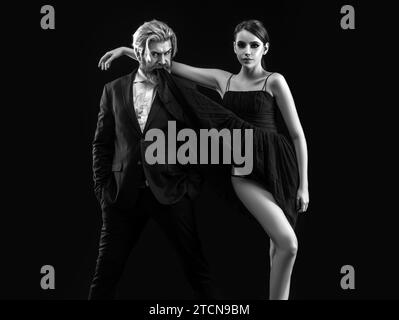 Salsa dancing couple. Young luxury pair dance isolated on black background. Romantic Stock Photo