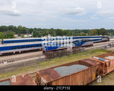 drone photos of various rail cars and amtrak trains on a cloudy day in downtown raleigh north carolina Stock Photo