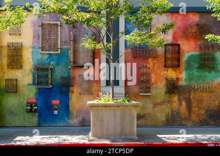 Colorful wall with wrought iron pattern at an alley in Santana Row,  San Jose, California, USA Stock Photo