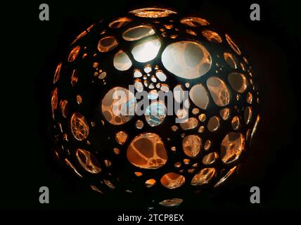 Close-up of illuminated lighting equipment against black background Stock Photo