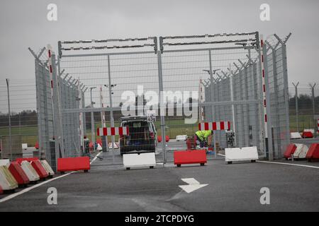 Hamburg, Germany. 13th Dec, 2023. Concrete barriers secure an entrance to the airfield at the north gate of Hamburg Airport. On Thursday, the Committee on Internal Affairs and Economic Affairs will meet to discuss the hostage-taking at Hamburg Airport on November 4, 2023 and the airport's security concept. Credit: Christian Charisius/dpa/Alamy Live News Stock Photo