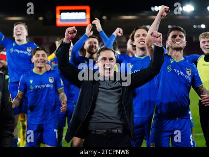 File photo dated 01-03-2023 of Grimsby Town' players and manager Paul Hurst celebrate after the Emirates FA Cup fifth round match. League Two Grimsby dumped Premier League Southampton out of the FA Cup while Tottenham were stunned at Championship side Sheffield United. Issue date: Thursday November 14, 2023. Stock Photo