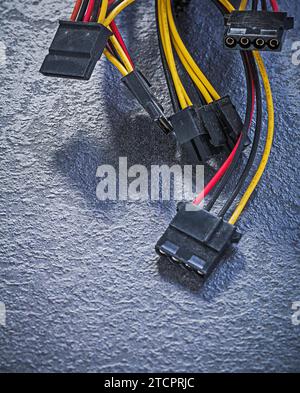 Electrical cables with plugs on black background Top view of electricity concept Stock Photo