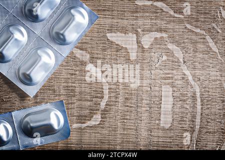 Medicinal pills in blister packs on wood Stock Photo