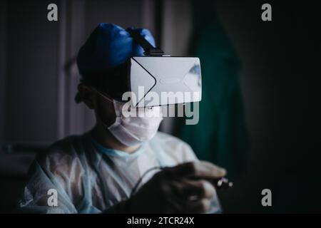 Doctor scientist in vr helmet is trained in virtual reality glasses Stock Photo