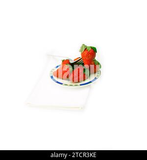 Fresh strawberries on little dish isolated over white Stock Photo