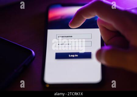 Login with username and password on smartphone app Stock Photo