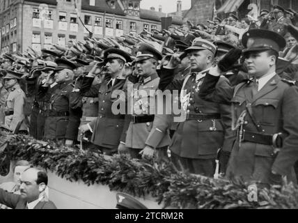 At the Nuremberg Party Rally, foreign military attachés are present, highlighting the international military interest in the events of the Nazi regime. Their attendance at such a highly propagandized event reflects the global military community's attention to the developments in Germany. These rallies, known for their grandiose displays and speeches, were not only domestic propaganda tools but also served to showcase Nazi military and political might to an international audience. Stock Photo