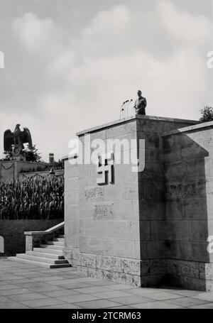 The speaker's tribune in the Luitpold Arena at the Reichsparteitag grounds in Nuremberg is a notable architectural element, embodying the grand scale and ideological symbolism of Nazi rallies. This tribune was a focal point during the party rallies, where Adolf Hitler and other high-ranking officials delivered speeches to massive crowds. Its design and location within the Luitpold Arena were carefully chosen to enhance the impact of these events, serving as a powerful tool for propaganda and demonstrating the regime's ability to mobilize and orchestrate large public gatherings. Stock Photo