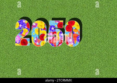 calendar year 2050 written with colorful flowers on green background, graphic, computer montage, graphic design, Agenda 2050 Stock Photo