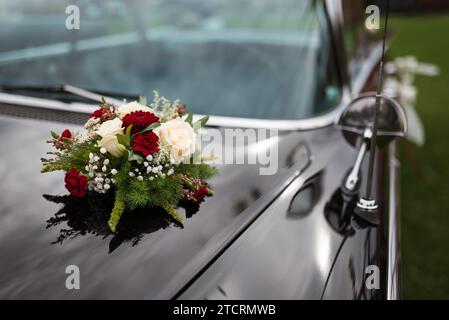 A bouquet of flowers on a stylish limousine Stock Photo