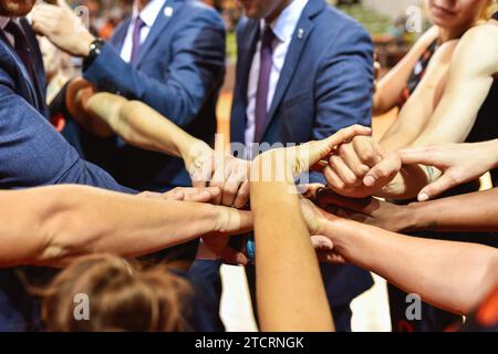 Hands of women sport team with coaches hands before match Stock Photo