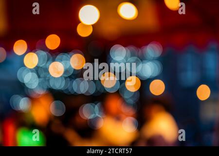 A Christmas bokeh background featuring a vibrant array of festive colors. The sparkling bokeh lights create a perfect for holiday-themed designs, invi Stock Photo