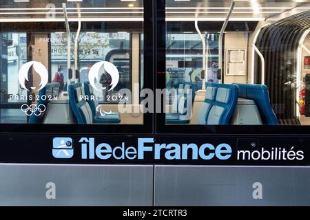 Paris, France. 12th Dec, 2023. Illustration of a tram with a logo of the 2024 Paris Olympics and Ile De France Mobilites on December 12, 2023. Metro tickets will almost double in price during the Paris Olympics 2024 to help cover the cost of running urban transport with millions more visitors in the capital during the Games, the regional transport authority said. Single tickets will be sold for four euros ($ 4.37), compared to 2.10 euros now, and 10-ticket blocks for 32 euros, compared to 16.90 currently. Photo by Alexis Jumeau/ABACAPRESS.COM Credit: Abaca Press/Alamy Live News Stock Photo