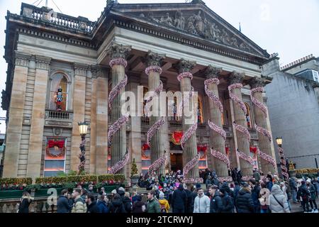 People outside the Dome restaurant looking at it's Christmas decorations. Stock Photo