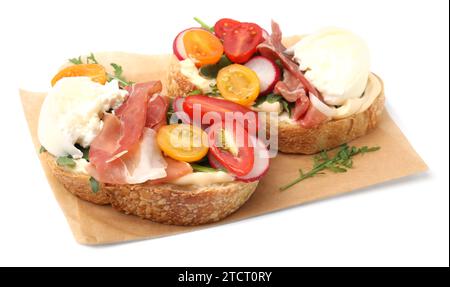 Delicious sandwiches with burrata cheese, ham, radish and tomatoes isolated on white Stock Photo