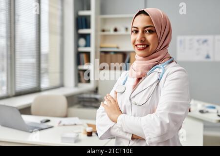 Portrait of Confident Muslim Doctor in Clinic Office Stock Photo