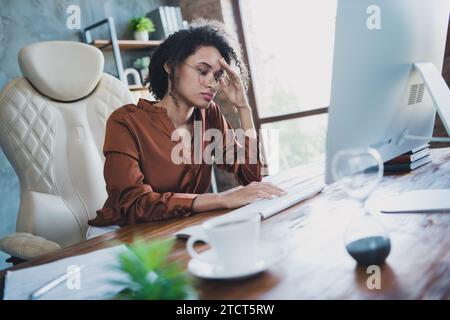 Photo of exhausted it specialist lady fell asleep drowse sitting chair networking modern business center inside Stock Photo