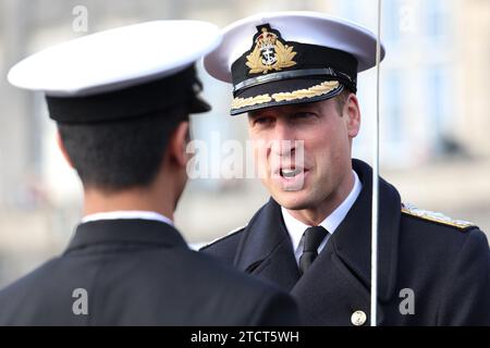 The Prince of Wales attends the Lord High Admiral's Divisions at the Britannia Royal Naval College, Dartmouth, to view a parade of 202 Royal Navy Cadets passing out with International Officer Cadets from Oman, Kuwait, Bangladesh and Trinidad and Tobago. Picture date: Thursday December 14, 2023. Stock Photo