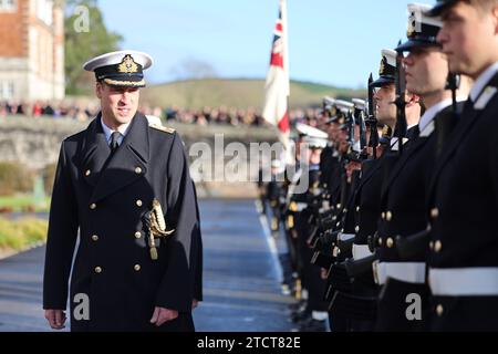 The Prince of Wales attends the Lord High Admiral's Divisions at the Britannia Royal Naval College, Dartmouth, to view a parade of 202 Royal Navy Cadets passing out with International Officer Cadets from Oman, Kuwait, Bangladesh and Trinidad and Tobago. Picture date: Thursday December 14, 2023. Stock Photo