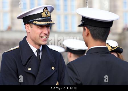 The Prince of Wales attends the Lord High Admiral's Divisions at the Britannia Royal Naval College, Dartmouth, to view a parade of 202 Royal Navy Cadets passing out with International Officer Cadets from Oman, Kuwait, Bangladesh and Trinidad and Tobago. Picture date: Thursday December 14, 2023. Stock Photo