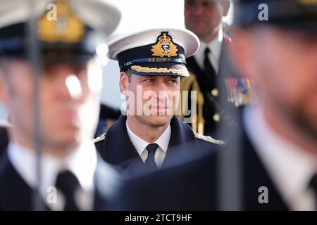 The Prince of Wales attends the Lord High Admiral's Divisions at the Britannia Royal Naval College, Dartmouth, to view a parade of 202 Royal Navy Cadets passing out with International Officer Cadets from Oman, Kuwait, Bangladesh and Trinidad and Tobago. Picture date: Thursday December 14, 2023. Stock Photo