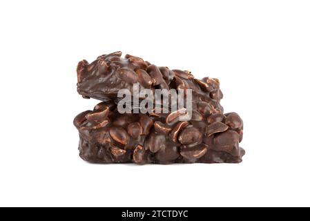 Two bars of sweet brownies with nuts and covered with chocolate on a white background. Copy space. Stock Photo