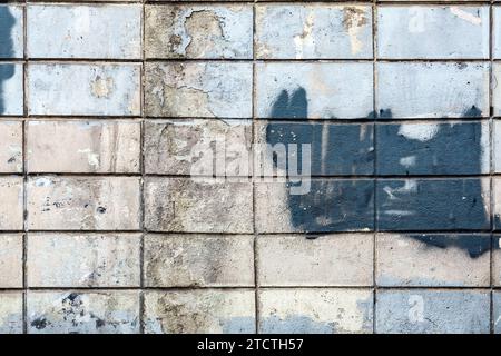 Rectangular bas relief stone tiled blocks close up texture background, textured and stained surface design element Stock Photo