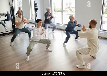 Elderly People Practicing Prayer Pose Stock Photo