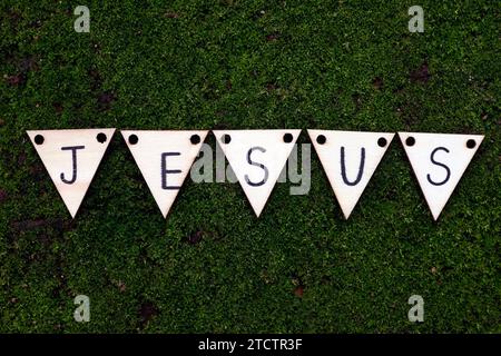 Wooden letters forming the word Jesus. Stock Photo