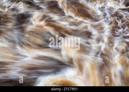 Fast flowing water over rocks. Randolf's Leap, River Findhorn, Morayshire, Scotland. Long exposure abstract Stock Photo