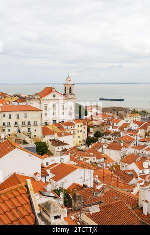 view over rooftops to the Church of St George Castle, Igreja de Santa Cruz do Castelo. Lisbon, Portugal Stock Photo