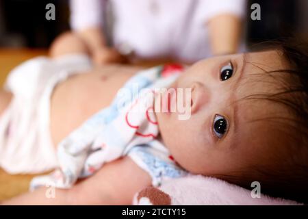 Children's pavilion run by Domincan catholic sisters. Child suffering of heart disease. Medical consultation. Stock Photo