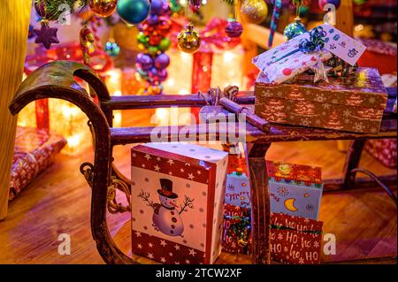 Colorful Christmas decoration with an old wooden sleigh. Stock Photo