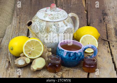 Ginger tea with lemon an honey on a wooden table Stock Photo