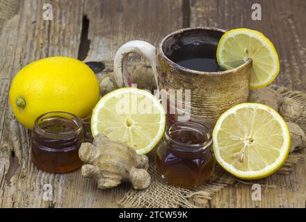 Ginger tea with lemon an honey on a wooden table Stock Photo