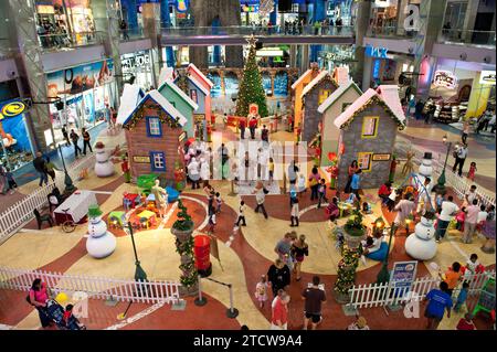 A Christmas village for children at the Gateway Theatre of Shopping in Umhlanga. Every year as part of the festive season Gateway constructs a special area that families and kids can come to enjoy Father Christmas or Santa Claus. Gateway Theatre of Shopping or Gateway is one of the largest shopping centre in Africa and the largest in the southern hemisphere. It is located on Umhlanga Ridge in Umhlanga, north of Durban, KwaZulu-Natal, South Africa. Gateway is particularly busy over the festive season when thousands of shoppers visit the centre to do their shopping.   Construction commenced on 3 Stock Photo