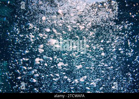 Blue ocean and a lot of air bubbles in transparent water. Stock Photo