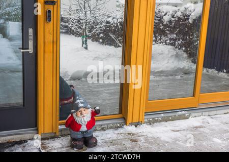 Close-up view of Santa Claus standing in front of entrance door. Sweden. Stock Photo