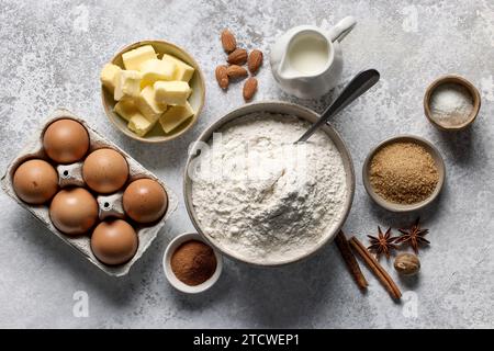 various baking ingredients on light grey painted kitchen table background, top view Stock Photo